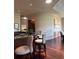 Inviting kitchen features granite counters, dark wood cabinets, breakfast bar, and stainless steel sink at 1802 Hartford Path, The Villages, FL 32162
