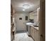 Well-organized laundry room with ample storage, modern appliances, and sleek countertops at 1802 Hartford Path, The Villages, FL 32162