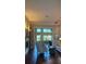 Elegant living room featuring hardwood floors, stylish furnishings, and abundant natural light at 1802 Hartford Path, The Villages, FL 32162