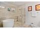 Serene bathroom with soaking tub, glass-enclosed shower, and neutral tile at 1831 Mizell Ave, Winter Park, FL 32789