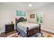 Charming bedroom features dark wood furniture, a plush rug, and a bright window for a cozy retreat at 1831 Mizell Ave, Winter Park, FL 32789