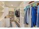 Large walk-in closet with custom shelving, built-in drawers, and ample storage space at 1831 Mizell Ave, Winter Park, FL 32789