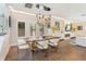 Elegant dining room featuring a unique light fixture and hardwood floors at 1831 Mizell Ave, Winter Park, FL 32789