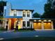 Contemporary two-story home boasts striking stone accents and a three-car garage at 1831 Mizell Ave, Winter Park, FL 32789