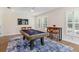 Entertainment room featuring a billiard table, ceiling fan, and ample seating area at 1831 Mizell Ave, Winter Park, FL 32789