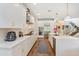 Modern kitchen with white cabinets, stainless steel appliances, and hardwood flooring at 1831 Mizell Ave, Winter Park, FL 32789