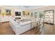 Bright living room boasts hardwood floors, ample natural light, and a modern fireplace at 1831 Mizell Ave, Winter Park, FL 32789