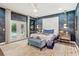Stylish main bedroom with textured accent wall, contemporary lighting, and french doors at 1831 Mizell Ave, Winter Park, FL 32789