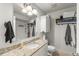 Light and bright bathroom with large mirror, storage cabinet and modern finishes at 1956 Lake Atriums Cir # 146, Orlando, FL 32839