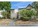 Inviting two-story condo with well-maintained landscaping and exterior features under a sunny sky at 1956 Lake Atriums Cir # 146, Orlando, FL 32839