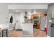 Functional kitchen features wood cabinets, granite counters, and modern stainless steel appliances at 1956 Lake Atriums Cir # 146, Orlando, FL 32839