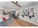 Comfortable living room features an open layout to the kitchen with modern decor and wood-look floors at 1956 Lake Atriums Cir # 146, Orlando, FL 32839