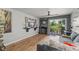 Bright living room featuring seamless access to the outdoors with water views, perfect for relaxation at 1956 Lake Atriums Cir # 146, Orlando, FL 32839