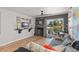 Bright living room featuring seamless access to the outdoors with water views, perfect for relaxation at 1956 Lake Atriums Cir # 146, Orlando, FL 32839
