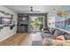 Bright living room featuring seamless access to the outdoors with water views, perfect for relaxation at 1956 Lake Atriums Cir # 146, Orlando, FL 32839