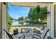 Covered patio with seating and views of the lake at 1956 Lake Atriums Cir # 146, Orlando, FL 32839