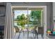 Covered patio with comfortable seating offers picturesque views of the adjacent lake at 1956 Lake Atriums Cir # 146, Orlando, FL 32839