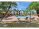 Inviting community pool area with palm trees, lounge chairs, and well-maintained landscaping at 1956 Lake Atriums Cir # 146, Orlando, FL 32839