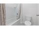 Clean bathroom showcasing a well-maintained tub and shower with a modern toilet, perfect for everyday comfort at 2155 Kalin Way, Tavares, FL 32778