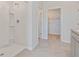 Bright bathroom with a tiled floor and a spacious walk-in shower, perfect for modern living at 2155 Kalin Way, Tavares, FL 32778