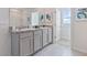 Modern bathroom featuring double sinks and granite countertops, offering both style and functionality at 2155 Kalin Way, Tavares, FL 32778