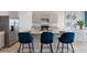 Stylish kitchen with stainless steel appliances, granite countertops, and a breakfast bar with seating at 2155 Kalin Way, Tavares, FL 32778
