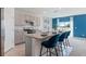 Charming kitchen boasts a gray color scheme, granite counters, stainless appliances, and a breakfast bar at 2155 Kalin Way, Tavares, FL 32778