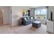 Inviting living room space with a cozy couch, neutral tones, and ample natural light at 2155 Kalin Way, Tavares, FL 32778