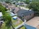 Aerial view of a fenced backyard featuring an above ground pool and screened lanai at 2239 Meadowmouse St, Orlando, FL 32837