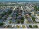 Aerial view showcasing the neighborhood, roads, and home rooftops at 2239 Meadowmouse St, Orlando, FL 32837