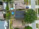 Aerial view of a backyard with an above ground pool, surrounded by a residential neighborhood at 2239 Meadowmouse St, Orlando, FL 32837
