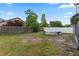 Spacious backyard with an above ground pool, partially fenced at 2239 Meadowmouse St, Orlando, FL 32837