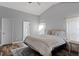 Bedroom with a bed, rug, and two windows at 2239 Meadowmouse St, Orlando, FL 32837