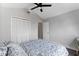 Bright bedroom featuring a vaulted ceiling, large closet and ceiling fan at 2239 Meadowmouse St, Orlando, FL 32837