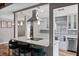 Modern kitchen with bar stool seating, white countertops, stainless steel appliances, and open concept at 2239 Meadowmouse St, Orlando, FL 32837