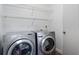Bright laundry room featuring side-by-side washer and dryer at 2239 Meadowmouse St, Orlando, FL 32837