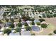 A lovely house is surrounded by trees in a peaceful neighborhood with a golf course in the distance at 2503 Squaw Crk, Clermont, FL 34711