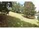 Spacious backyard with mature trees, lush grass, and a gentle slope, offering privacy and natural beauty at 2503 Squaw Crk, Clermont, FL 34711