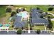 Aerial view of a community pool featuring ample seating, palm trees, and a covered gazebo at 2503 Squaw Crk, Clermont, FL 34711