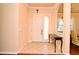 Bright foyer featuring neutral walls, tile flooring, and an elegant entry table at 2503 Squaw Crk, Clermont, FL 34711