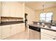 Open kitchen area with stainless appliances, granite counters and breakfast bar next to a dining nook at 2503 Squaw Crk, Clermont, FL 34711