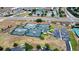 Aerial view of tennis courts with parking, landscaping, and a community building at 2503 Squaw Crk, Clermont, FL 34711