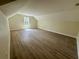 Large bedroom with hardwood floors, vaulted ceilings, and a big window at 335 Ruth Blvd, Longwood, FL 32750