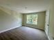 Well-lit bedroom with hardwood floors and a view to the outside at 335 Ruth Blvd, Longwood, FL 32750