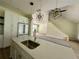 Kitchen featuring quartz countertops, stainless steel appliances, eat-in island and wood flooring at 335 Ruth Blvd, Longwood, FL 32750