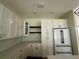 Modern kitchen featuring white cabinets, quartz countertops, and stainless steel appliances at 335 Ruth Blvd, Longwood, FL 32750