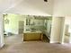 Open concept kitchen featuring eat-in island, white cabinets, and stainless steel appliances at 335 Ruth Blvd, Longwood, FL 32750