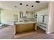 Kitchen featuring eat-in island, white cabinets, stainless steel appliances and wood flooring at 335 Ruth Blvd, Longwood, FL 32750