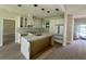 Modern kitchen with granite counters, an island, and stainless steel appliances at 335 Ruth Blvd, Longwood, FL 32750