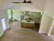 Open kitchen layout with a vaulted ceiling, quartz island, and modern geometric pendant lights at 335 Ruth Blvd, Longwood, FL 32750